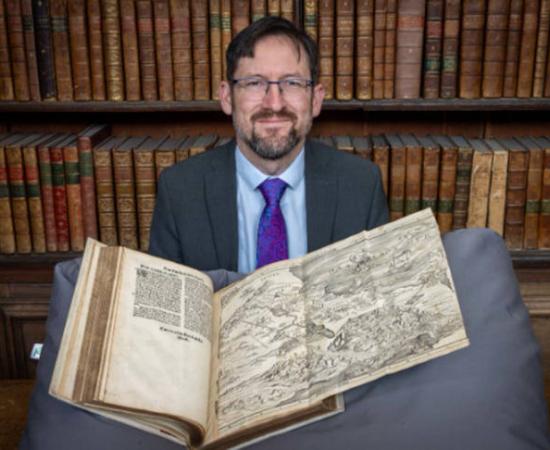 Nathan MacDonald with the Bible map in Trinity College's Wren Library