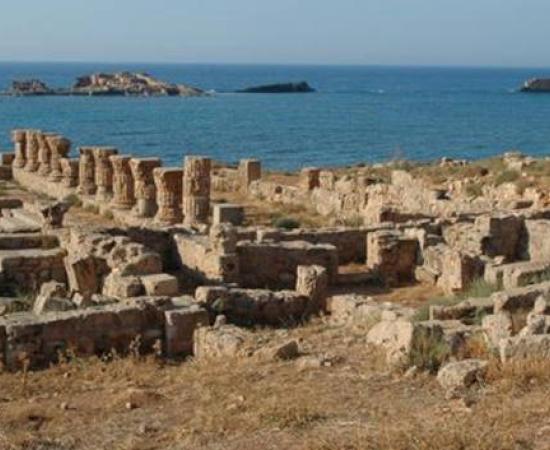 Remains of mole (background) and bath house (foreground) of the ancient harbor town of Apollonia, Libya