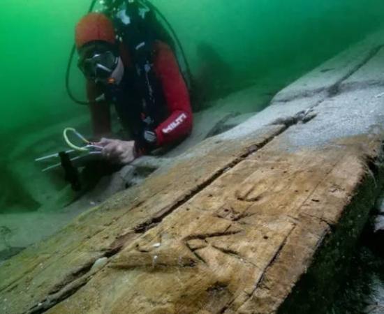 The boat’s well-preserved timbers  including grafitti.