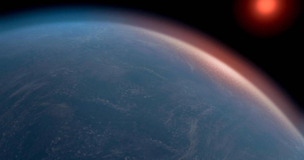 Artist’s conception of a big, blue K2-18b orbiting its red dwarf star.