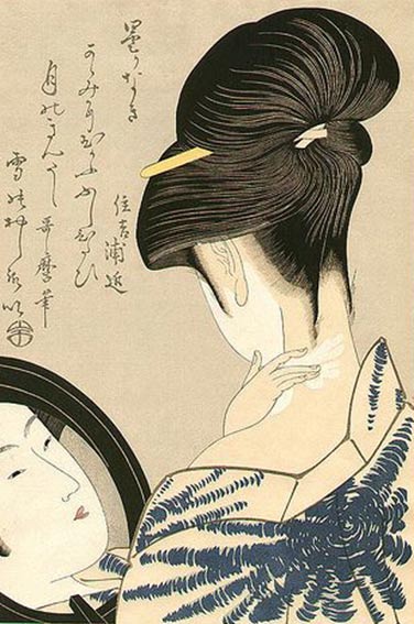 A woman painting her face and neck white