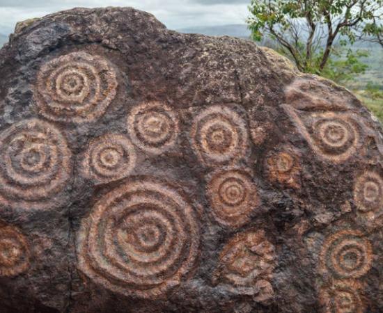 Spirals or concentric circles rock art engraving on a boulder in Venezuela.